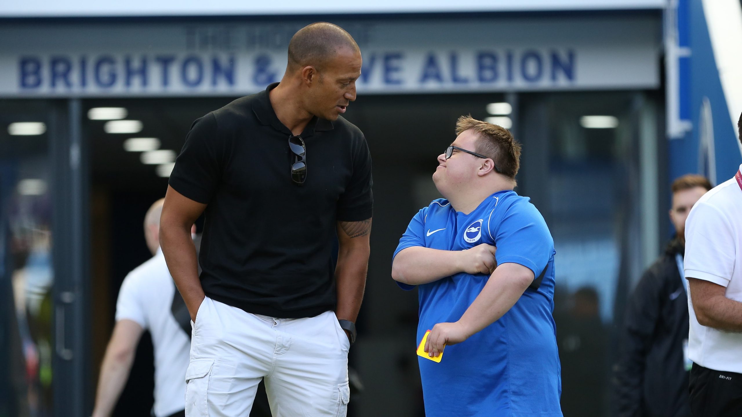 Ex-player talking to a disability football participant